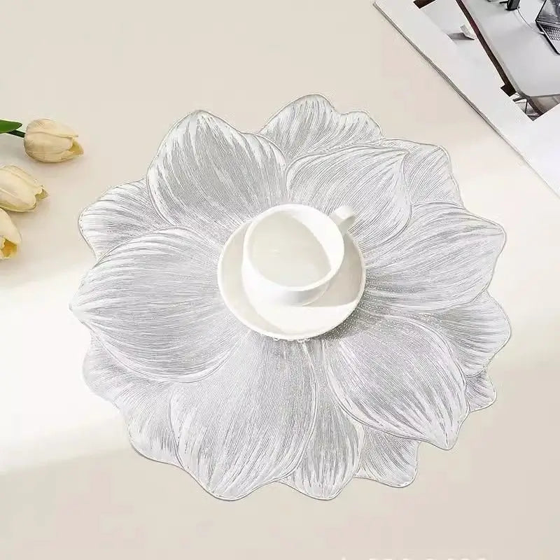 Silver lotus flower placemat under a white cup and saucer