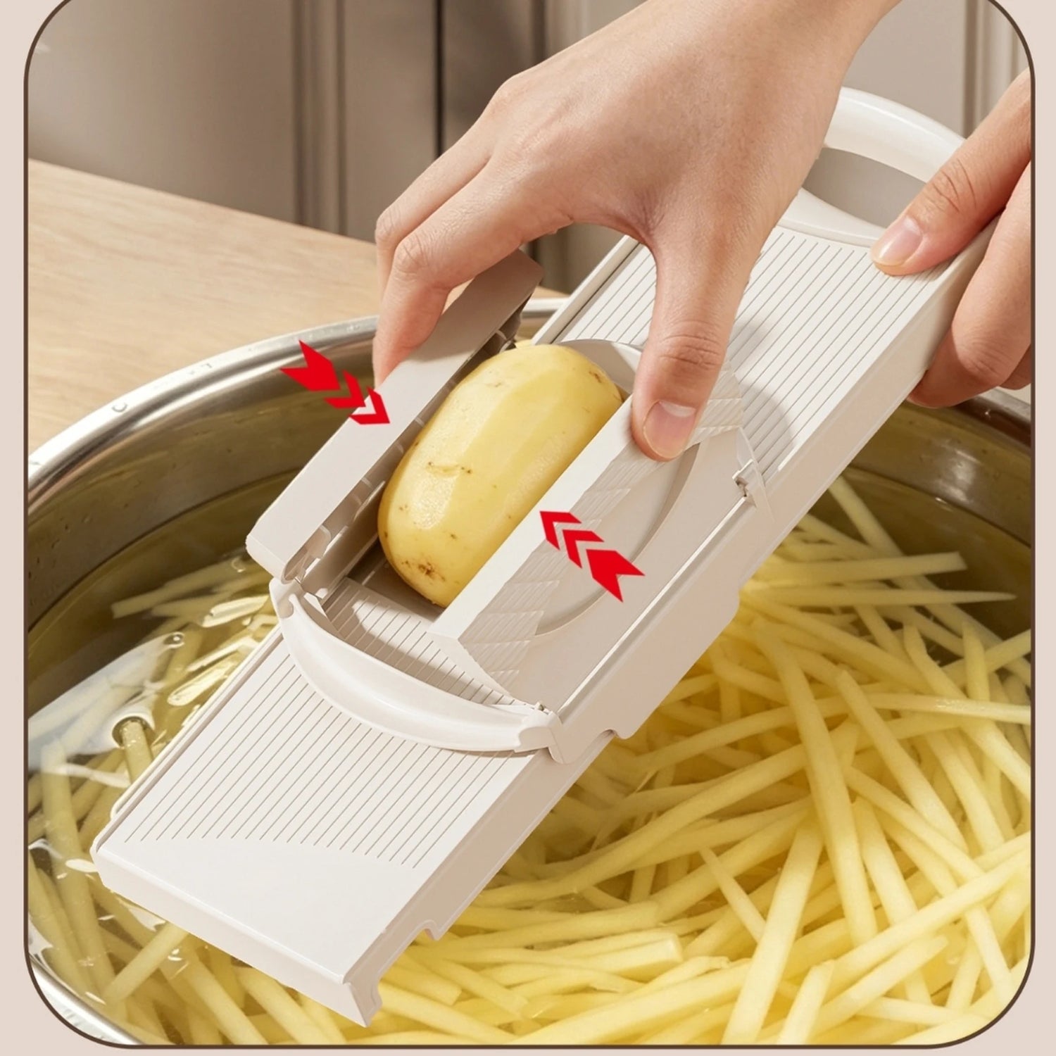 PrepGlide hand guard holding a potato over a bowl