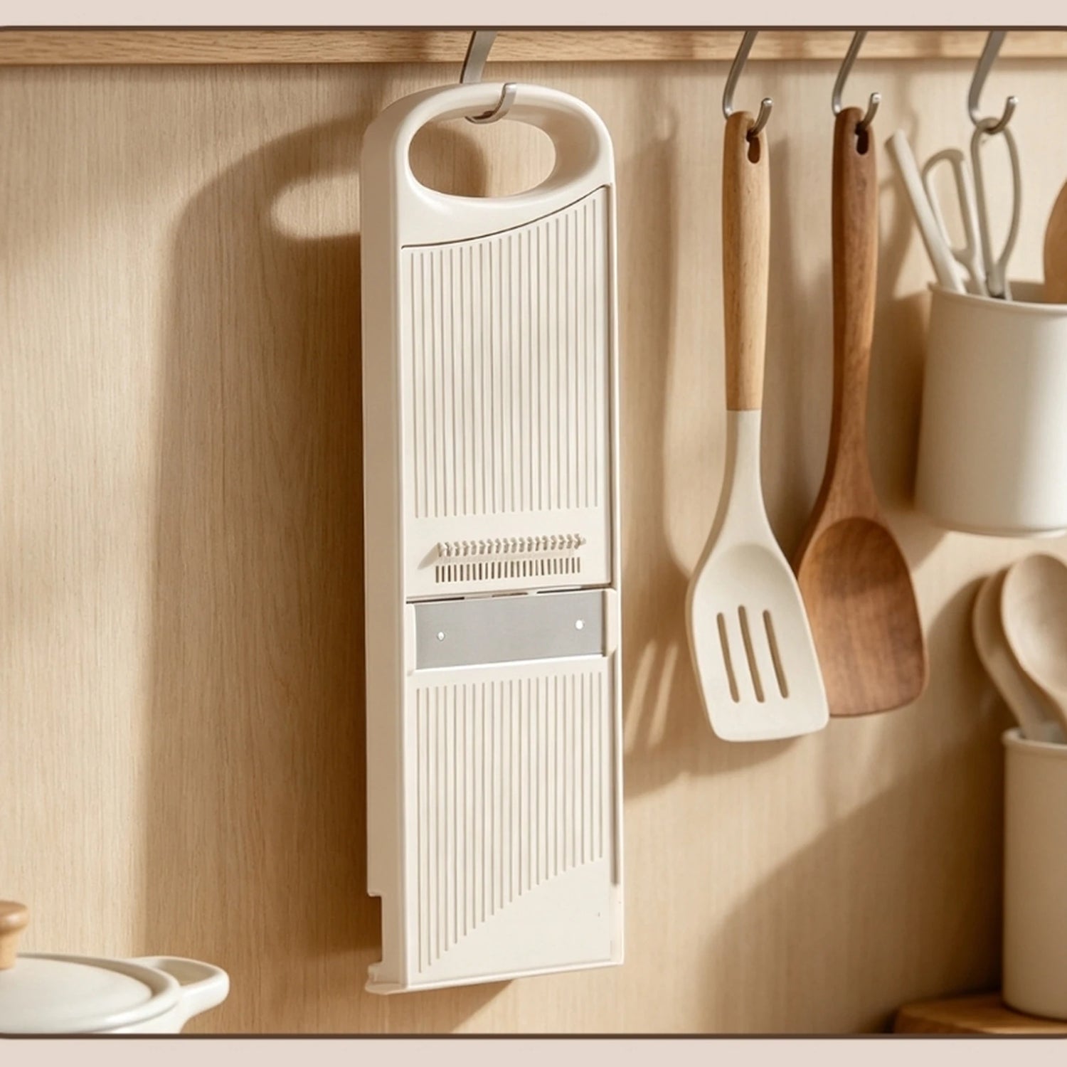 PrepGlide slicer stored vertically on a kitchen hook