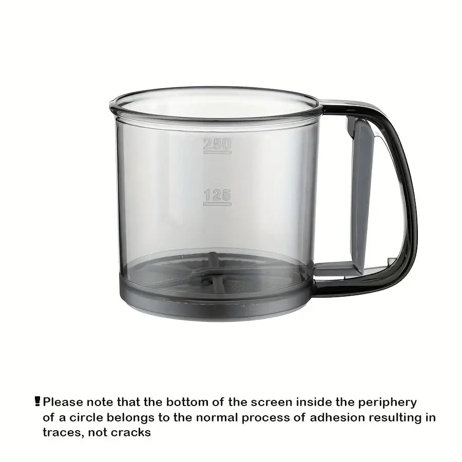 Clear glass mug with black handle on a white background