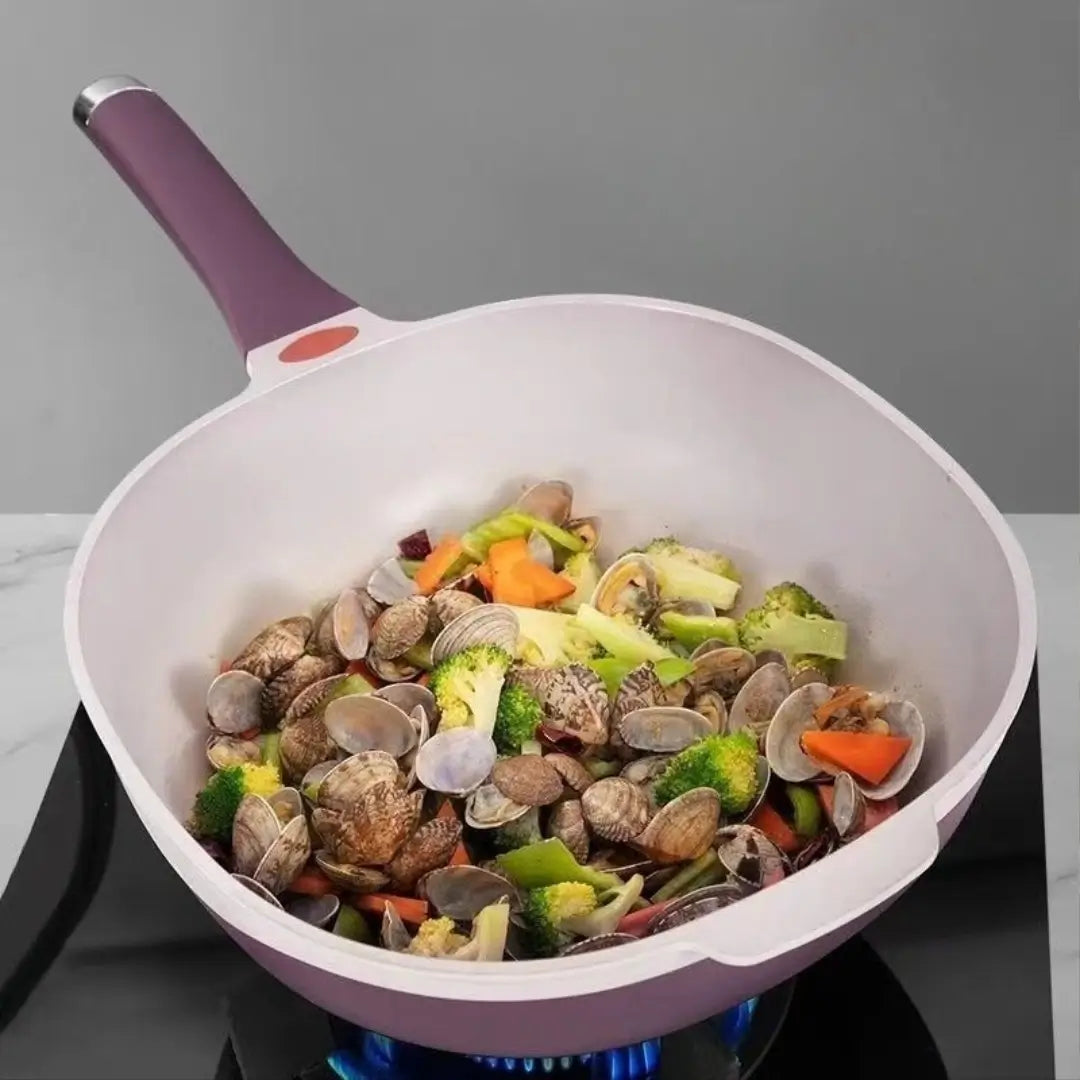 Seafood and vegetables in the deep ceramic cooking surface