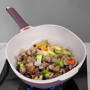 Seafood and vegetables in the deep ceramic cooking surface