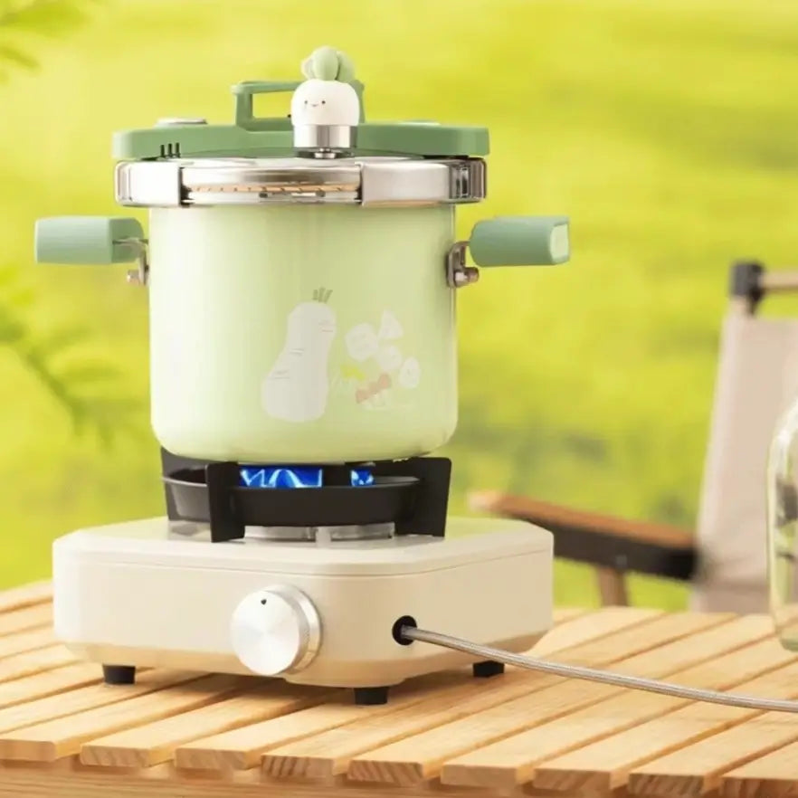 Compact Enamel Pressure Cooker on a portable gas stovetop