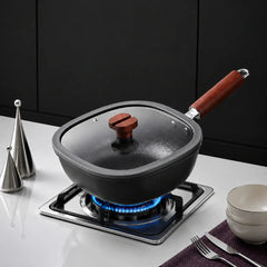 Hero — hammered titanium iron pan on a gas stovetop