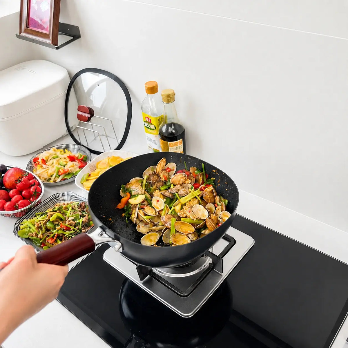 Clam stir-fry prepared in the deep hammered pan