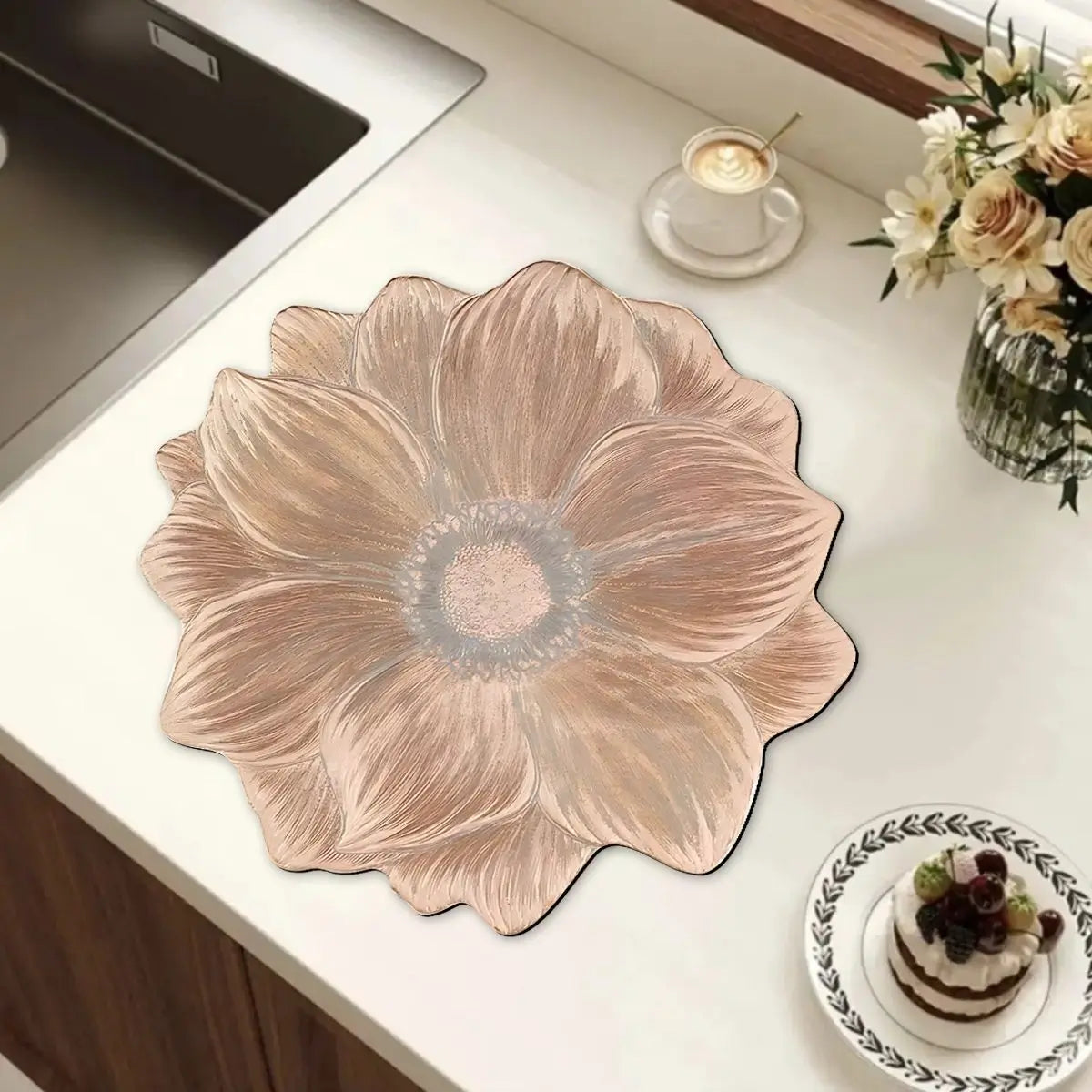 Pinkish Gold lotus flower placemat on a light kitchen countertop