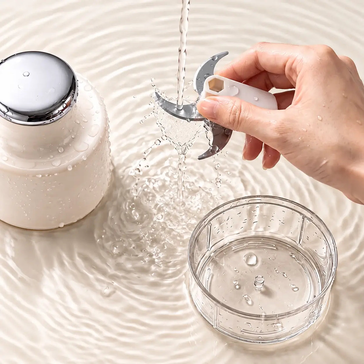 Removable blade assembly held by its plastic center and rinsed separately