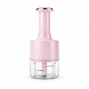 Pink manual garlic chopper with clear chopping cup and press handle