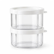 Two clear storage cups with white lids, shown without a chopper