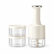 White manual press garlic chopper with two matching lidded storage cups