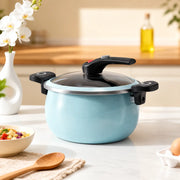 Blue soup pot on a kitchen stovetop