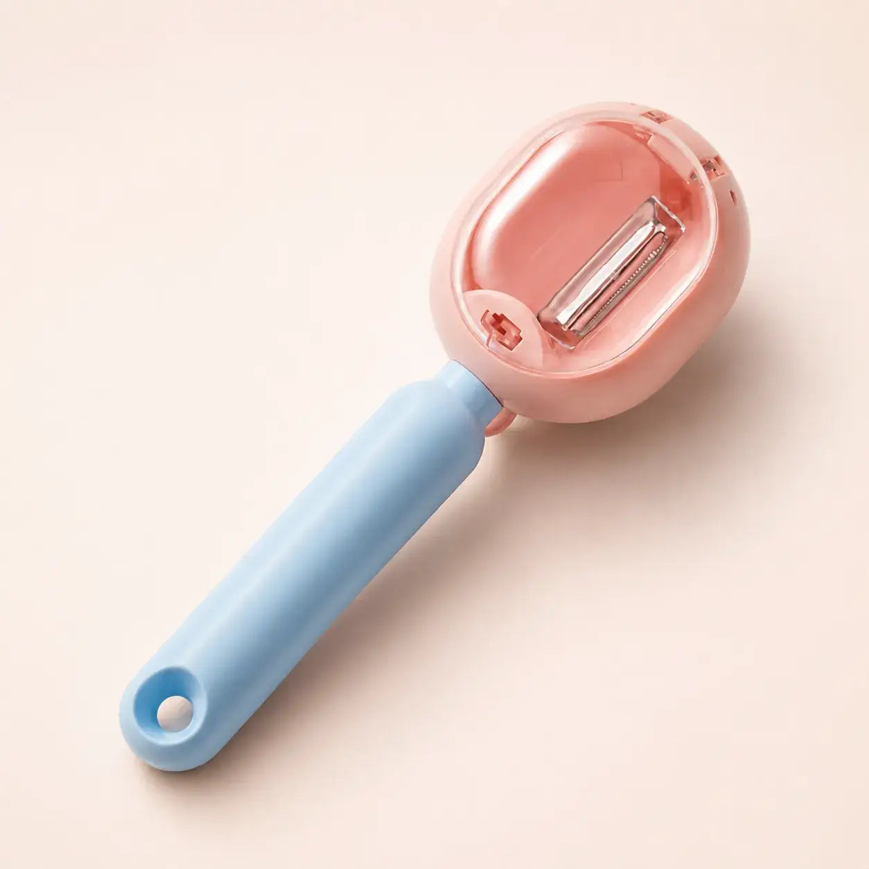 Pink PeelCatch vegetable peeler studio view