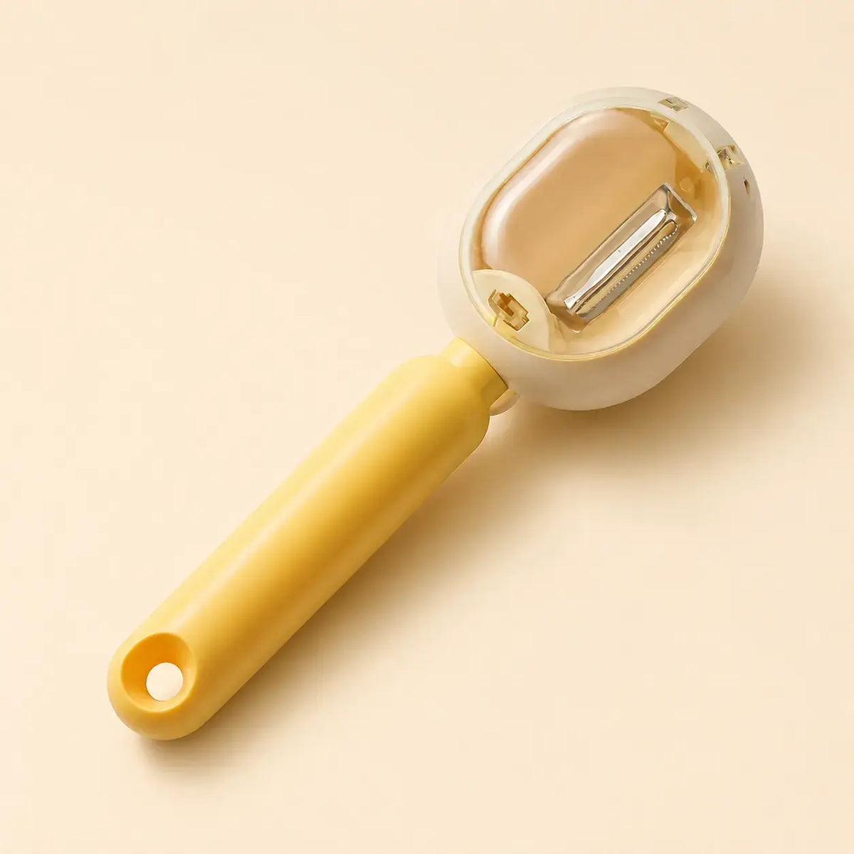 Yellow PeelCatch vegetable peeler studio view