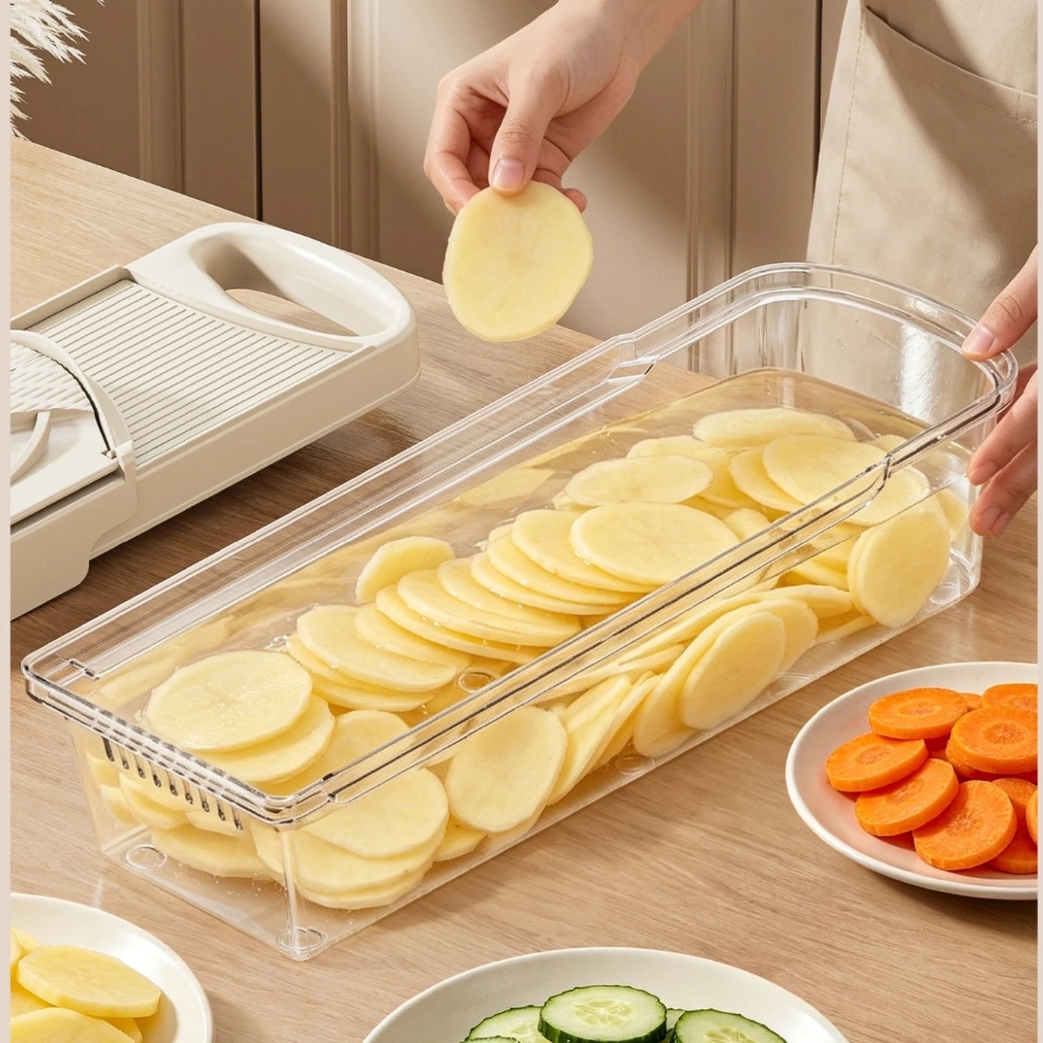 Potato slices soaking inside the clear PrepGlide catch box