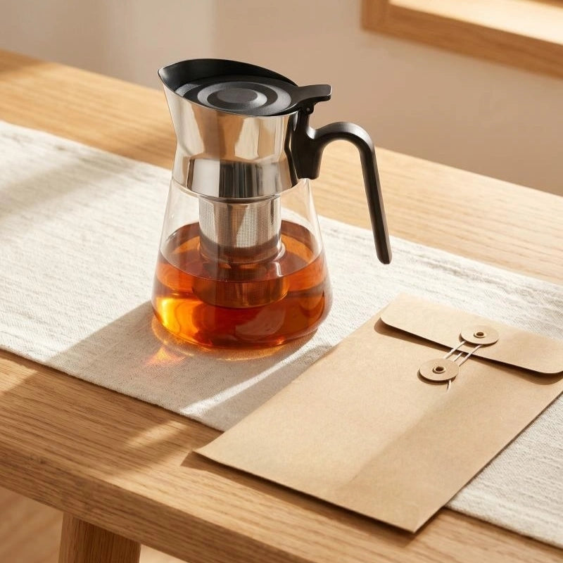 PressBrew glass teapot ready for tea at a desk
