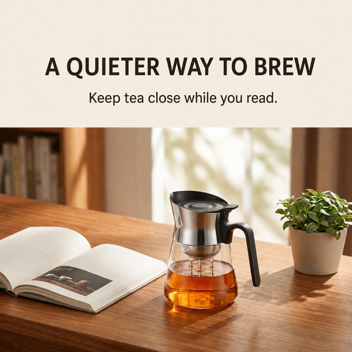 PressBrew glass teapot beside an open book
