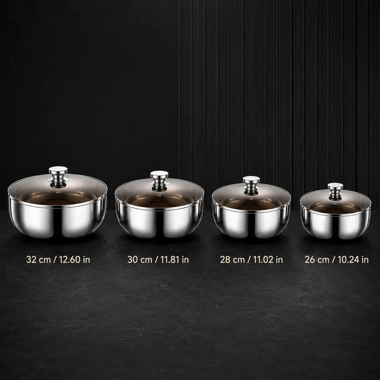 Four stainless steel mixing bowl sizes arranged from 32 to 26 centimeters