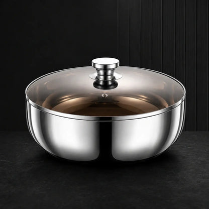 Polished stainless steel mixing bowl with smoky glass lid on a dark surface