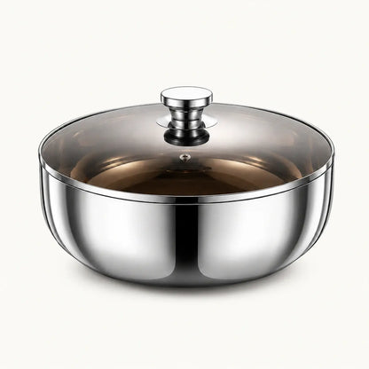 Polished stainless steel mixing bowl with smoky glass lid on a white background