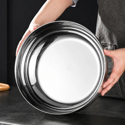 Close view of the polished flat base of a stainless steel mixing bowl