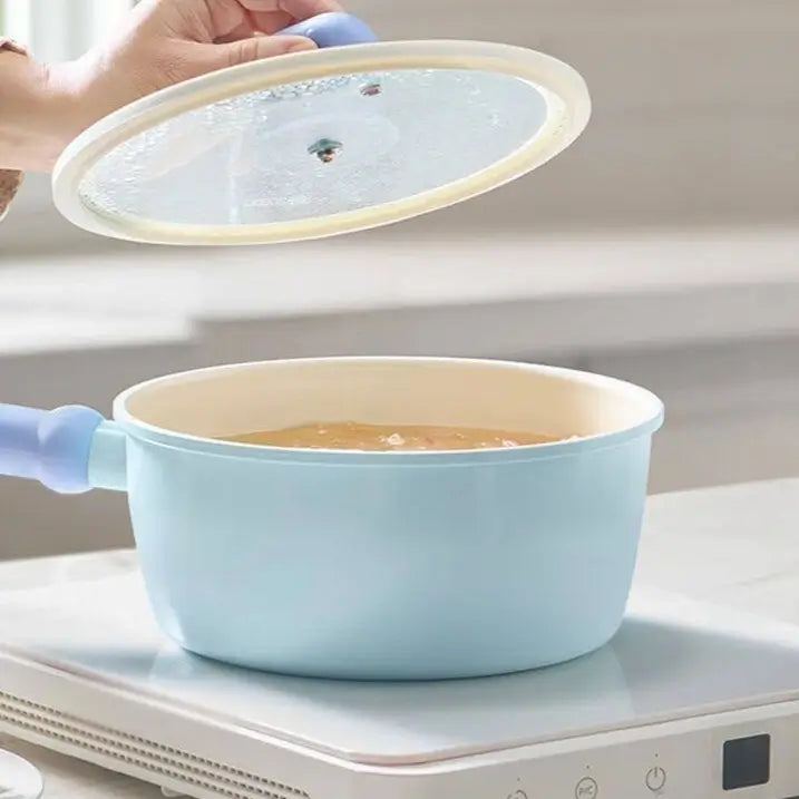 Clear glass lid lifted from the Little Blue Ceramic Pot