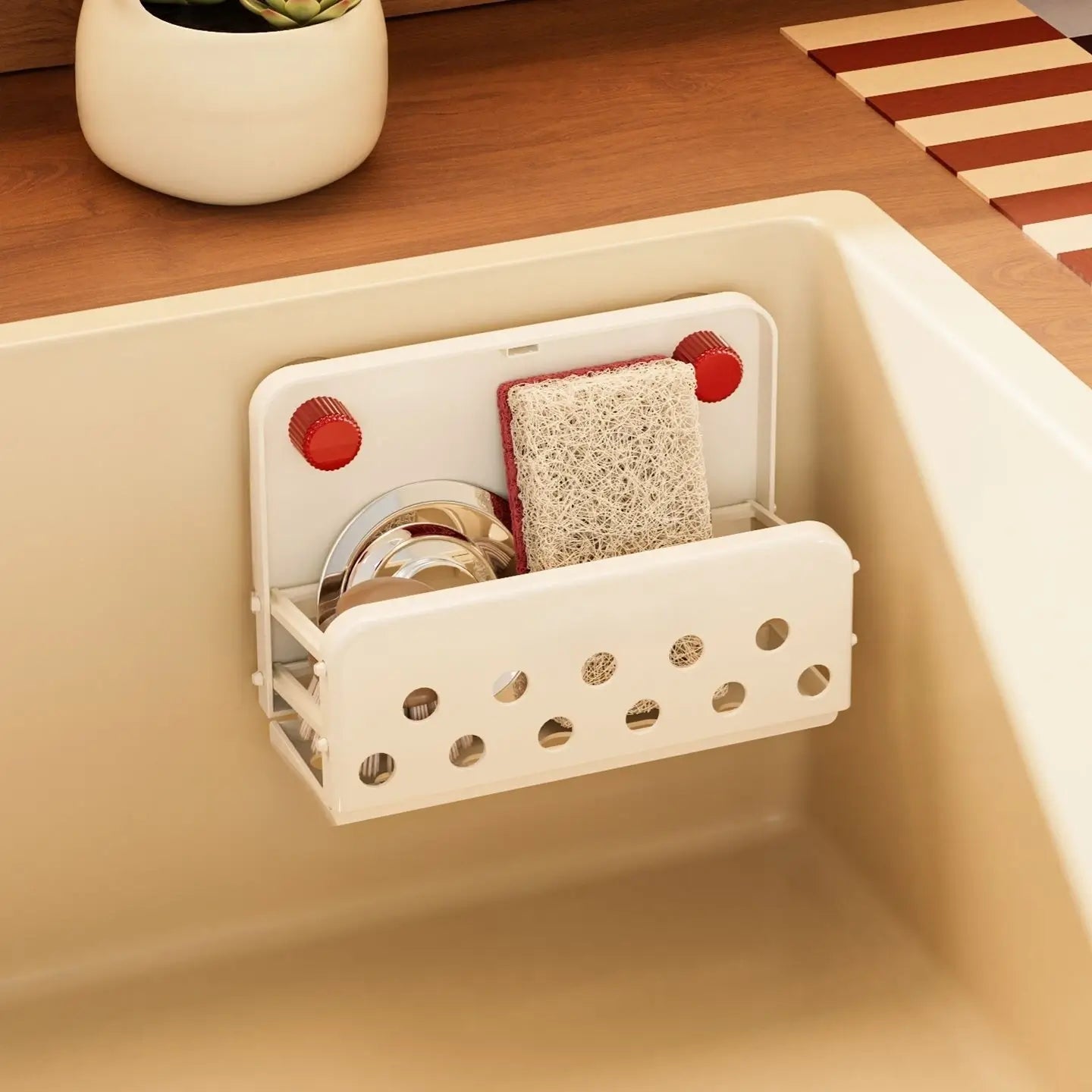 Off-white FoldAway Sink Caddy mounted inside a sink